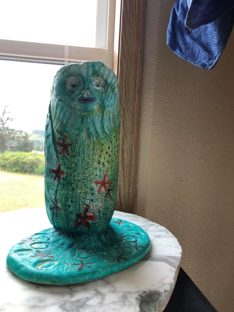 A ceramic owl perched on a table